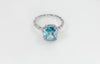 Blue Zircon Ring Wrapped in Diamonds
