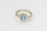 Blue Topaz and White Diamond Surround Ring