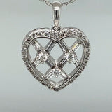 Spectacular Round and Baguette Diamond Heart Pendant